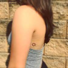 Small Sun Tattoo On The Back Sun Tattoo Small Sun Tattoos Sun Tattoo Ribs
