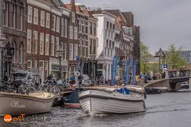 Bootjes kijken aan de waterkant of mensen kijken die. Touring The Netherlands From Leiden Beautiful Grachten And Yummy Pannenkoeken