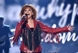 In junior high school, she performed with her musical siblings, aka the singing mcentires. Reba Mcentire S Life In Photos Reba Through The Years