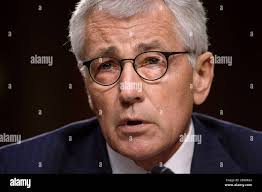 WASHINGTON, D.C. (September 16, 2014) Chief Musician James Swarts, left, of  the United States Navy Band has his anchors pinned by his wife and family  during the Navy Band pinning ceremony in