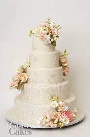 It's best to leave the icing to dry overnight before stacking. Wedding Cake Inspiration Ron Ben Isreal Wedding Cakes Ivory With Pastel Flowers