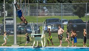 Swimmers flock to city pools to beat the heat with free-pass program