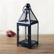 Black iron lantern shown with separately available black metal willow tree lampshade. Decorative Black Hanging Iron Candle Lantern Buy Decorative Lantern Hanging Lanterns Iron Lantern Product On Alibaba Com