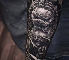 Best Black And Grey Realism Tattoo Artists In The World Statue Tattoo By Ben Thomas Post 21367 Foo Dog Tattoo Statue Tattoo Foo Dog Tattoo Design