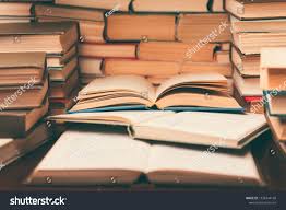 Education Learning Concept With Open Book And Notebook On The Table Stack Piles Of Books On Reading Desk And Glasses In Book Pile Of Books Open Book Education