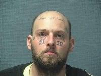 Police seize guns, arrest wanted man and his friend