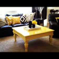 This Is What We Re Doing Black Couch With Black And White Striped Pillows With Yellow Accent Pillo Yellow Living Room Trendy Living Rooms Yellow Coffee Tables