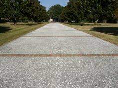 However, cracks and damage can occur. Oyster Shell Concrete Driveway With Brick Paver Apron Borders And Bands Is This Less Expensive Concrete Driveway Driveway Design Brick Pavers