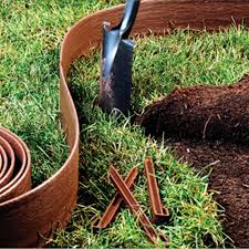 Drive one spike every 1.5 ft. Master Mark Terrace Board 5 In X 40 Ft Brown Landscape Lawn Edging With Stakes 95340 The Home Depot Lawn Edging Garden Border Edging Landscape Edging