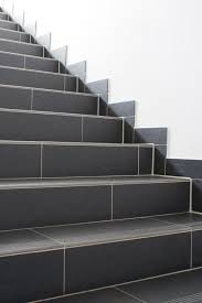 Solutions And Examples Of Porcelain Tile Staircases Tiled Staircase Tile Stairs Home Stairs Design