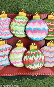 Soft christmas cookies in gingerbread man, candy cane, and tree shapes on. Marbled Christmas Ornament Cookies Haniela S Recipes Cookie Cake Decorating Tutorials