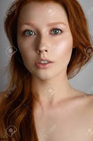 Dark auburn hair color complements well with deep. A Close Portrait Of A Red Haired Girl With Freckles And Blue Eyes With Radiant Skin And Loose Hair On Her Shoulders Stock Photo Picture And Royalty Free Image Image 140952810