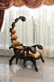 The chair measures in at six and a half feet and is available with leather upholstery and a variety of wood finishes. A Handcrafted Wooden Chair Shaped Like A Giant Scorpion