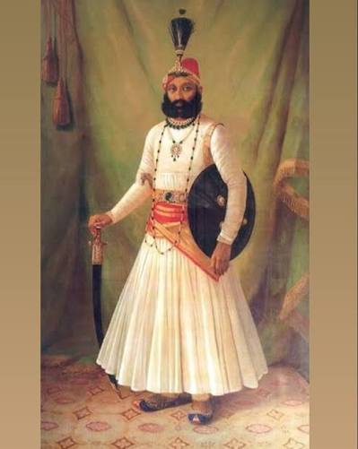 In this 1901 painting by Raja Ravi Varma, Maharana Fateh Singh wears a white Jama, a sword at his side, and a turban set with jewels. The Jama was a long, flared