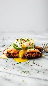 Smoked Salmon Eggs Benedict Over Sweet Potato Fritters Recipe By Jake Cohen The Feedfeed Recipe Sweet Potato Fritters Smoked Salmon And Eggs Eggs Benedict