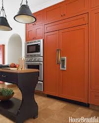 A Bold Burnt Orange Kitchen Burnt Orange Kitchen Orange Cabinets Kitchen Colors