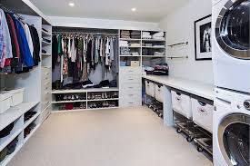 This is where the dirty clothes come off anyway, and there's easy access to hang and put away clean clothes. Master Closet With Washer Dryer Novocom Top