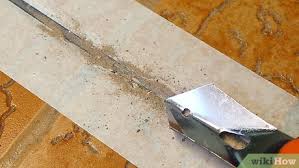 A grout saw is an almost trowel like tool that's about the size of a screwdriver. 4 Ways To Clean Grout Wikihow