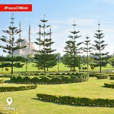 walking through the natural beauty of downtown adana with sabanci camii as the backdrop feel complete