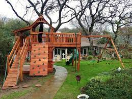 Create A Kid Cation For Your Outdoor Kids Enjoy Backyard Family Time With This Tree Fort Theoutdoorchild Treefort Decks Backyard Tree Deck Enjoy Backyard