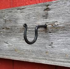 We forge several kinds of wrought iron hooks for whatever you need to hang. Screw In Wall Hooks Hand Forged Wrought Iron Wall Hooks Black Wall Hooks Metal Working