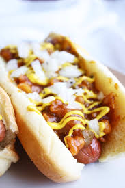 Place a hot dog on each bun; Baked Bean And Onion Dogs