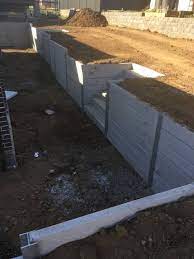 Retaining Walls For Smooth Gray Concrete Sleepers From Pioneer For More Informatio Backyard Retaining Walls Concrete Sleepers Concrete Sleeper Retaining Walls