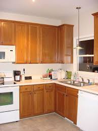 Chic antique style kitchen cabinets of wooden materials in white and cream. Old Oak Cabinets Painted White And Distressed Hometalk
