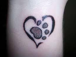 Tiny paw tattoo on wrist. 27 Cute Paw Tattoos Images