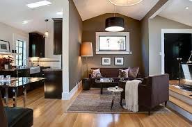 Muddy Tracks Decorating With Brown Brings Out The Best Brown Living Room Living Room Wood Floor Dark Brown Furniture
