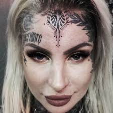 Image result for quirky pylon forehead tattoo