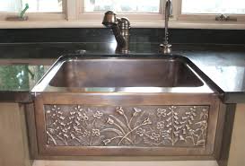 The hammered copper farmhouse sink fits the mood of this traditional kitchen. Chameleon Bronze Farmhouse Sink Sinks Gallery