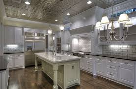 The final strip of old tile is covered with a trim piece. Blog Kitchens W Tin Ceiling Tiles American Tin Ceilings