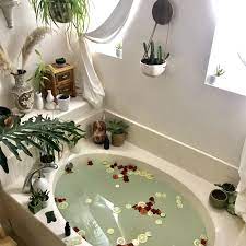 Traditional spa bathroom with women's faces on accent wall 4 photos. How To Have A Spa Day At Home 29 Diy Spa Ideas Glamour