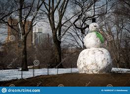 Giant Snowman With Carrot Nose And Green Scarf Shot In Central Park With Trees And Buildings In Background Stock Image Image Of House Famous 164854247
