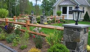 Cedar is a beautiful option, as it turns silver as it ages. Stone Pillars And Split Rail Fencing Enhance The Rustic Setting Description From Pinterest Com I Searched F Fence Landscaping Driveway Landscaping Front Yard