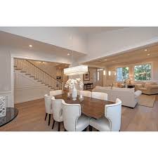 In this combination living room and dining room, light pours in through the large windows, giving the space an airy and open feel. Benziger 9 Light Kitchen Island Linear Pendant Beautiful Dining Rooms Living Room Dining Room Combo Dining Room Combo