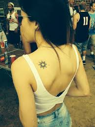 Shoulder tattoos can come in many different sizes from small to large. Amazing Black Sun Tattoo On Girl Left Back Shoulder