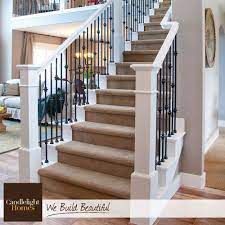White Wood Railings And Wrought Iron Spindles Create The Perfect Contrast For This Beautiful Sta Wrought Iron Stair Railing White Staircase Wrought Iron Stairs