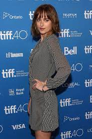 The Shape Shifting Power Of The Right Bangs Dakota Johnson Wears Hers Three Ways Dakota Johnson Hair Dakota Johnson Short Hair With Bangs