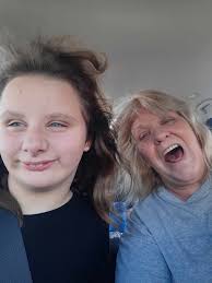 Proud grandmother congratulates granddaughter