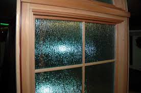 They feature a wood interior with a fiberglass exterior. Milgard Essence Wood Window
