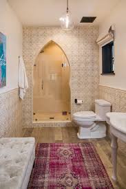 Another popular design idea is to install a small mural into a niche in the bathroom and using that as a centrepiece and then designing your other trims and field tiles around that piece! Spanish Style Bathroom Henkkon