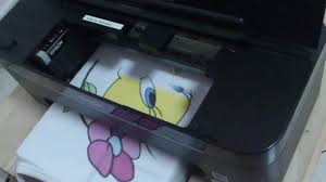 * the paper feeder pulls the paper all the way to the edge of the paper and prints it there, if you are facing the printer, it should be printing on the left side. Homemade Epson T13 Dtg 2