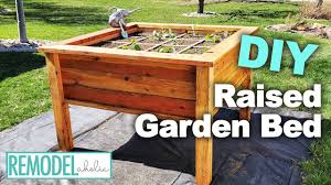 Finish your diy raised garden bed by moving it into the desired location in your yard and filling it with a growing medium of your choosing. How To Build A Diy Raised Garden Bed Square Foot Gardening Remodelaholic Youtube