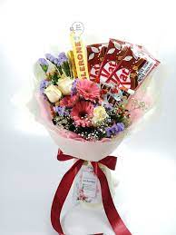 Basket arrangement of yellow flower like roses , gerberas and carnation along with celebration chocolate pack. Chocolate Flower Gifts Best Gifts For Chocolate Lover Delivery Gifts For All Occasions Chocolate Bouquet Chocolate Flowers Bouquet Chocolate Flowers