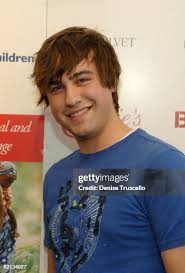 Fatal1ty and musicians Tru Threat and Fred Mo of G2G visit the Iconix...  News Photo