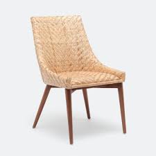The dining room is made for get togethers, dinner parties with friends and spending time with family. Woven Rattan Dining Chair Mecox Gardens