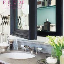 Surface mount medicine cabinet in white features a swing door and beveled mirror for a fashionable but functional bathroom accessory. Concealed Medicine Cabinet Design Ideas
