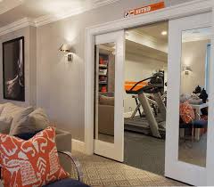 Creating a basement workout room is convenient, it's cost effective and it can be easy to do. Basement Exercise Room With Mirrored Pocket Doors Contemporary Media Room